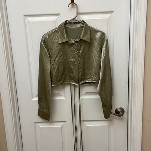 Sage green, cropped long sleeve button down, keyhole-open back. Crisscross ties.